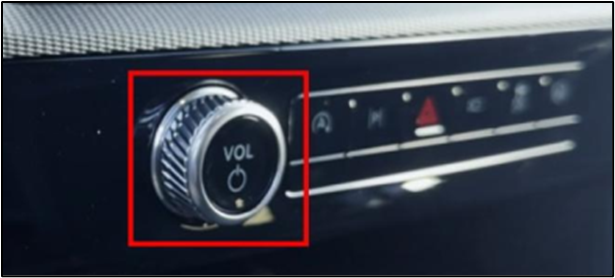 Radio Volume/Power button on center console below the touchscreen emphasized in a red box.