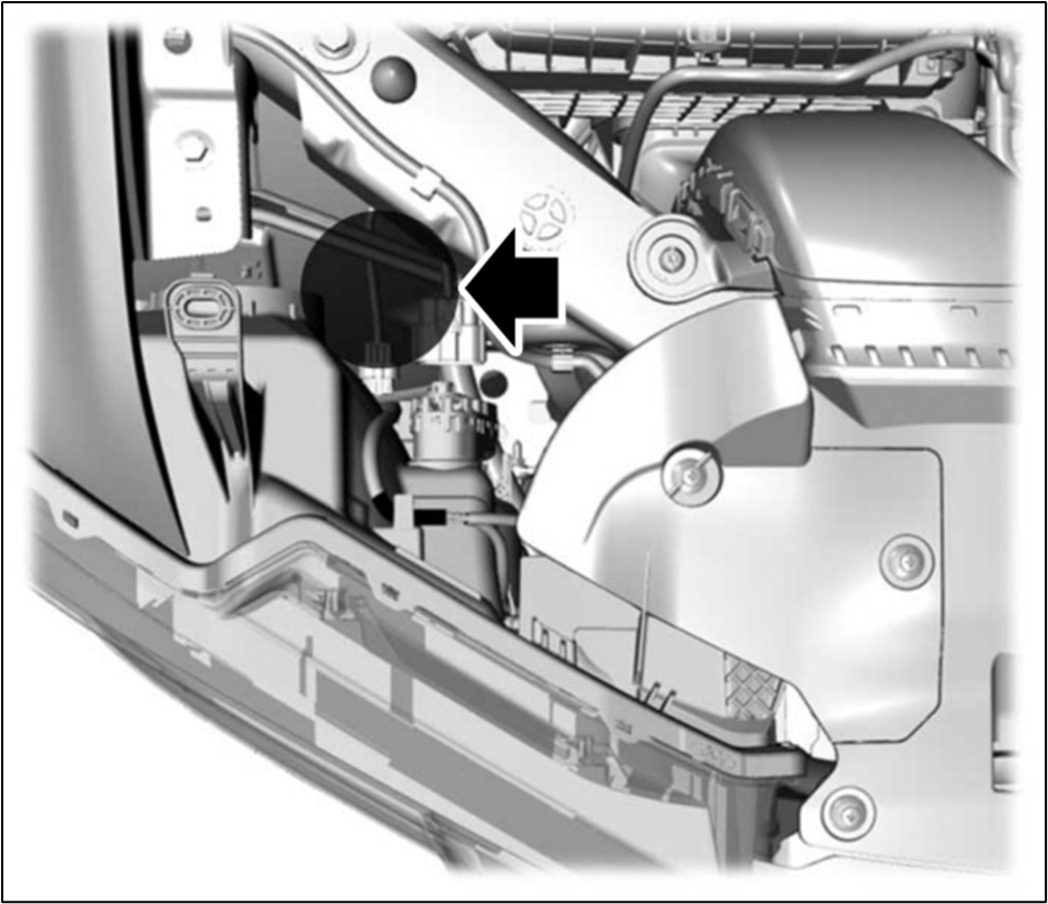 Reach into the space below the low beam socket.