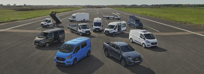 A variety of converted Ford vehicles are displayed on an airstrip, showcasing the range and versatility of the converted vehicle line.