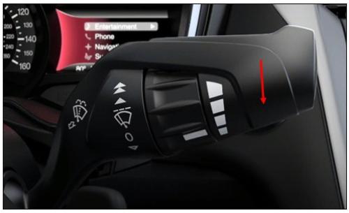 Windshield wiper stalk with red arrow pointing down, indicating you should push down on stalk.