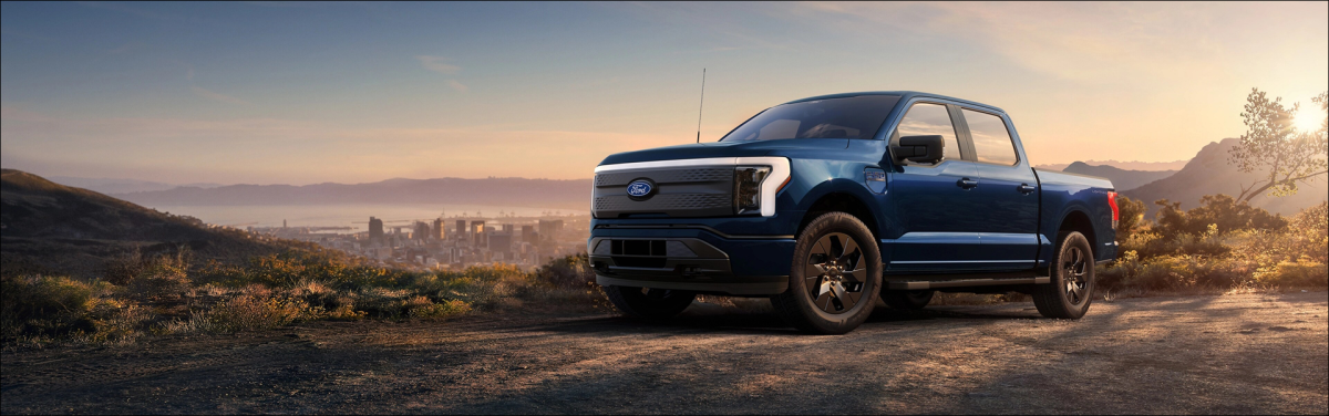 F-150 Lightning Parked on a dirt train in the hills during golden hour
