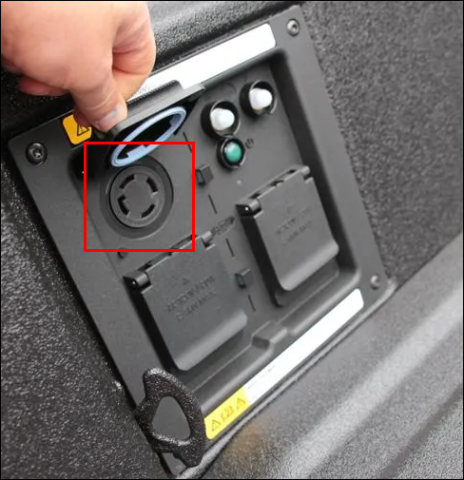 Ford Pro Power Onboard 240v outlet with a red box around it.